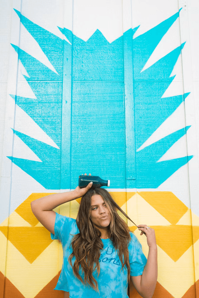 Woman with colorful bottle